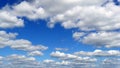 White fluffy clouds over blue sky on sunny day Royalty Free Stock Photo