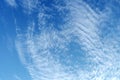 White fluffy clouds in the vast blue sky. Abstract nature background. Royalty Free Stock Photo