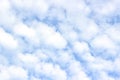 White fluffy cumulus clouds, blue sky