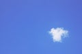 White fluffy single cloud on clear blue sky background Royalty Free Stock Photo