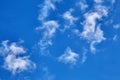 White fluffy clouds on a blue sky background