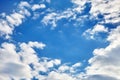 White fluffy clouds on a blue sky background