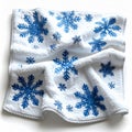 White Fluffy Towel with Blue Snowflake Patterns on White Isolated Surface Royalty Free Stock Photo