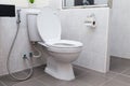 White flush toilet in modern bathroom Royalty Free Stock Photo