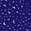 White Flying bat icon isolated seamless pattern on blue background. Vector Royalty Free Stock Photo