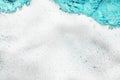 White foam blue water background closeup, sea or ocean foam wave pattern, froth bubbles texture, soap spume backdrop, soap sud