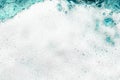 White foam blue water background closeup, sea or ocean foam wave pattern, froth bubbles texture, soap spume backdrop, soap sud Royalty Free Stock Photo