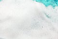 White foam blue water background closeup, sea or ocean foam wave pattern, froth bubbles texture, soap spume backdrop, soap sud Royalty Free Stock Photo