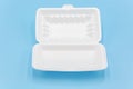 White foam box isolated on blue background Royalty Free Stock Photo
