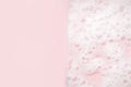 White foam bubbles texture on pink pastel background, copy space, banner for loundry, cleaning service, bathroom concept, clean, Royalty Free Stock Photo