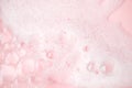 White foam bubbles texture on pink pastel background, copy space, banner for loundry, cleaning service, bathroom concept, clean, Royalty Free Stock Photo