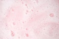 White foam bubbles texture on pink pastel background, copy space, banner for loundry, cleaning service, bathroom concept, clean, Royalty Free Stock Photo