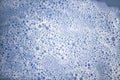 White foam bubles on blue color water Royalty Free Stock Photo