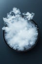 White foam dissipating from a dark bowl on a dark surface creating an abstract swirling cloud effect Royalty Free Stock Photo