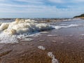 White foam on the sea shore, texture, abstract water reflections