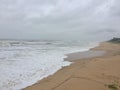 The white foamy waters of the Arabian Sea touching the shores of Maravante Beach, Kundapur