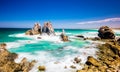 Foamy waves crashing on cliffs in Wallaga Lake on a sunny day