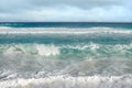 White foamy waves and gradually darkening color of sea Royalty Free Stock Photo