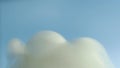 White fog against the sky. Smoke on a blue background. Formation of clouds in the sky. Slow motion. Intro, outro.Footage, the text