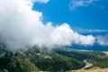 White fog high in the mountains on the Llogara pass. View from the highlands. Landscape of the Albanian Riviera Royalty Free Stock Photo