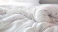 White folded duvet on bed for winter preparation, household, hotel or home textile concept. Royalty Free Stock Photo