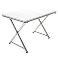 White folding table with silver X-shaped legs on white background portable table white surface Royalty Free Stock Photo