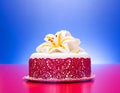 White fondant cake decorated with red lace and edible candy lily Royalty Free Stock Photo