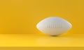White football ball isolated from yellow background Royalty Free Stock Photo