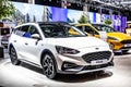 White Ford Focus station wagon, Brussels Motor Show,  4th gen, compact car produced by American automaker Ford Motor Royalty Free Stock Photo