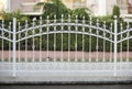 White forged iron fence