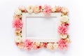 White frame decorated with pink roses flowers and leaves of eucalyptus. Flat lay, top view. Floral background. Floral Royalty Free Stock Photo