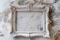 White frame hangs against cracked wall Royalty Free Stock Photo