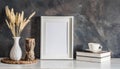 White frame and home decoration details on tabletop with wall, artwork poster mock-up Royalty Free Stock Photo