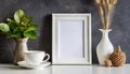 White frame and home decoration details on tabletop with wall, artwork poster mock-up Royalty Free Stock Photo