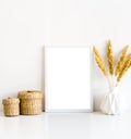 White frame and home decoration details on tabletop with wall, artwork poster mock-up Royalty Free Stock Photo