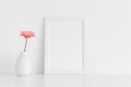 White frame mockup with a chrysanthemum in a vase on a white table. Portrait orientation Royalty Free Stock Photo