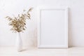 White frame mockup with decorative dried grass