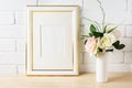 White frame mockup with pale pink roses in vase Royalty Free Stock Photo