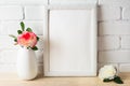 White frame mockup with pink and white roses Royalty Free Stock Photo