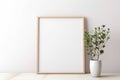 White frame mockup with plant in a pot on a floor