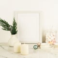 White frame mockup with thuja brances in white vase