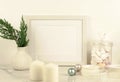 White frame mockup with thuja brances in white vase Royalty Free Stock Photo
