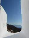 White frame with a panorama of coast and mountain to Amorgos in Greece.
