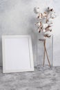 White frame with space, Mockup for design, with a vase and cotton. Light tender photo