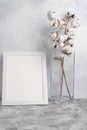 White frame with space, Mockup for design, with a vase and cotton. Light tender photo