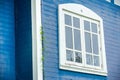 White frame window with blue wall at background Royalty Free Stock Photo