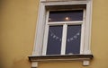 White frame window in old town building with christmas writing decoration