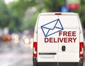 White free delivery Van driving fast on city blurr bokeh street Royalty Free Stock Photo