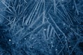 White freeze, ice crystal texture on blue background with bokeh. Royalty Free Stock Photo