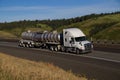 White Freightliner Semi-Truck / Tanker Trailer